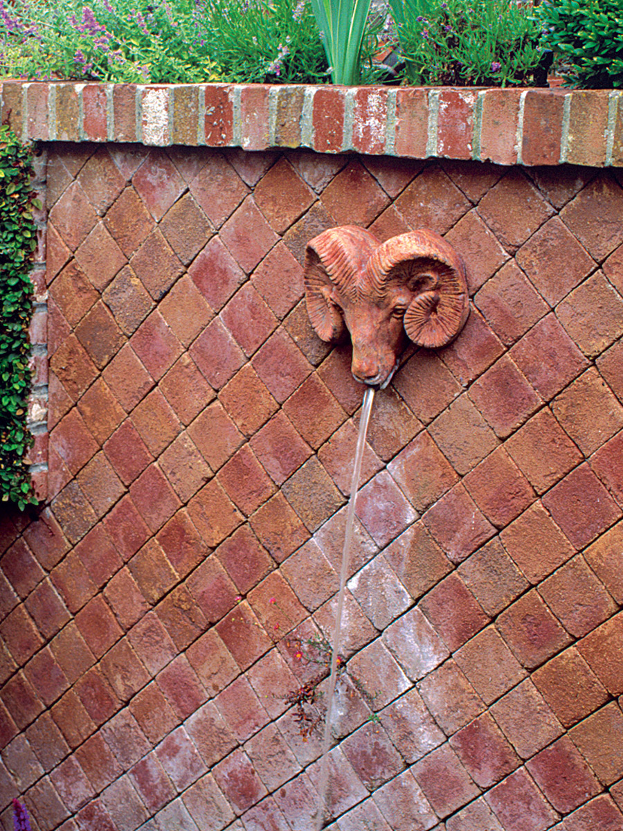 wall fountain with statue