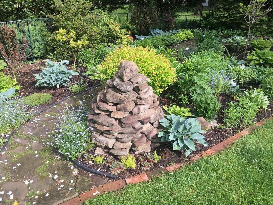 garden bed with a stack of stones