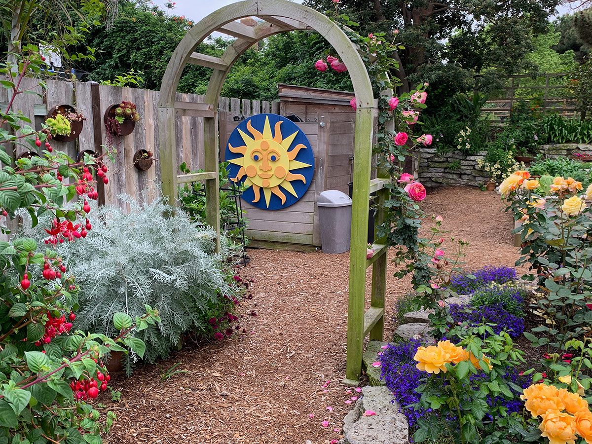 entrance to rose garden with arbor