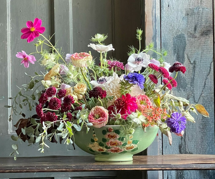 floral arrangement in green bowl