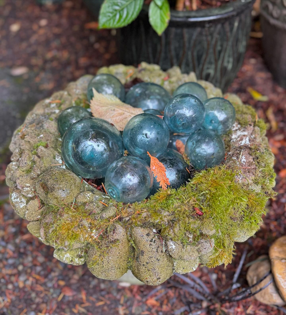 pot of blue glass orbs