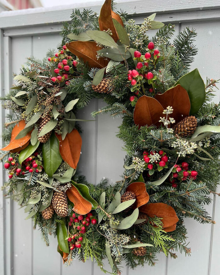 wreath with red berries and magnolia leaves