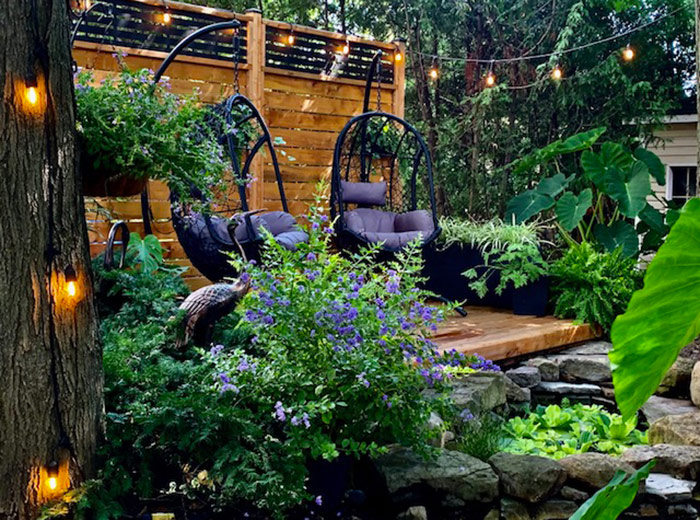 raised patio with swinging chairs