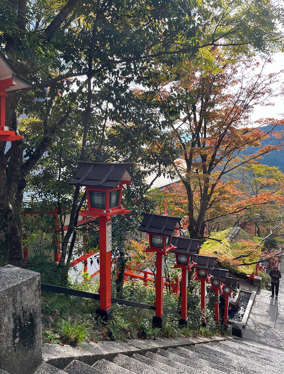 light posts that look like miniature red temples along staircase