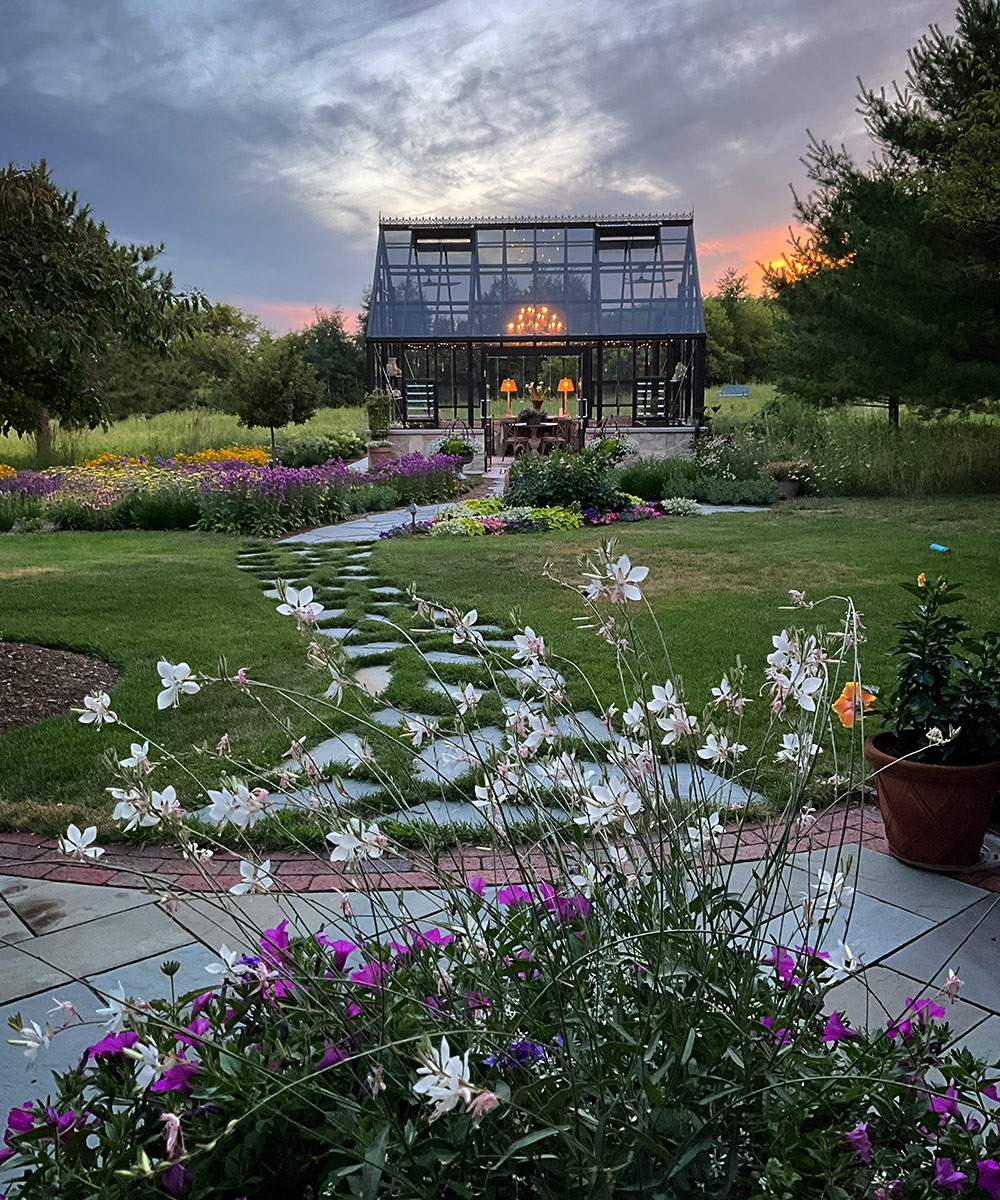 patio and path that leads to glass greenhouse